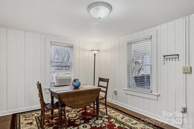 dining room with cooling unit and hardwood / wood-style floors