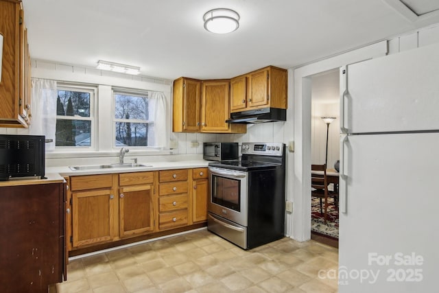 kitchen with sink and appliances with stainless steel finishes