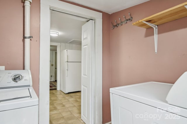 laundry area with separate washer and dryer