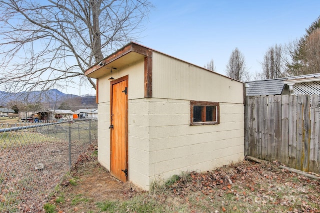 view of outbuilding featuring a mountain view