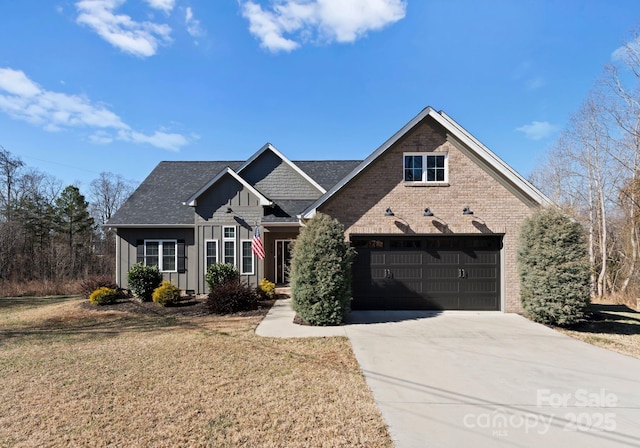 view of front of property with a garage and a front lawn