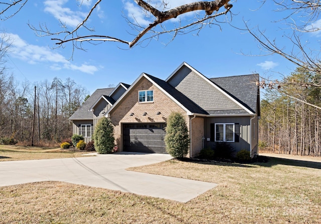 view of front of home featuring a garage and a front yard