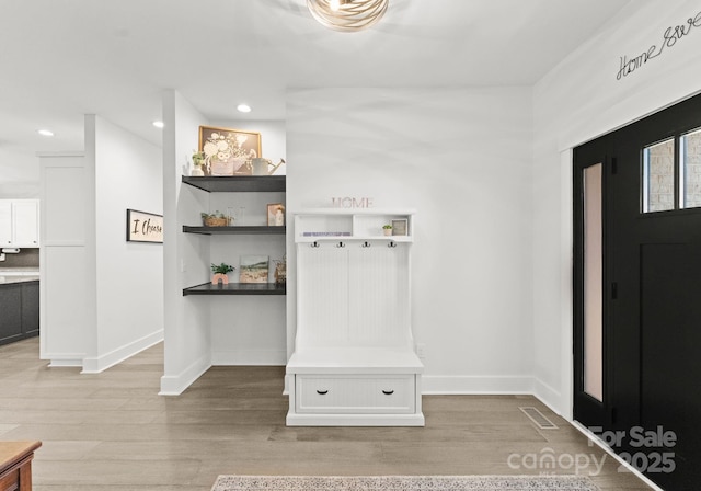 mudroom with hardwood / wood-style floors