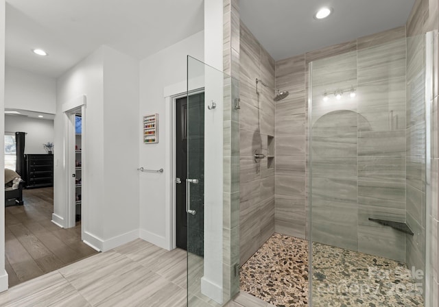 bathroom featuring tiled shower