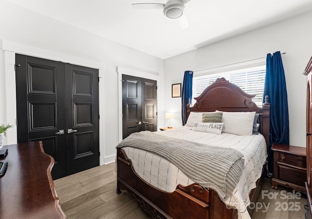 bedroom featuring ceiling fan and light wood-type flooring