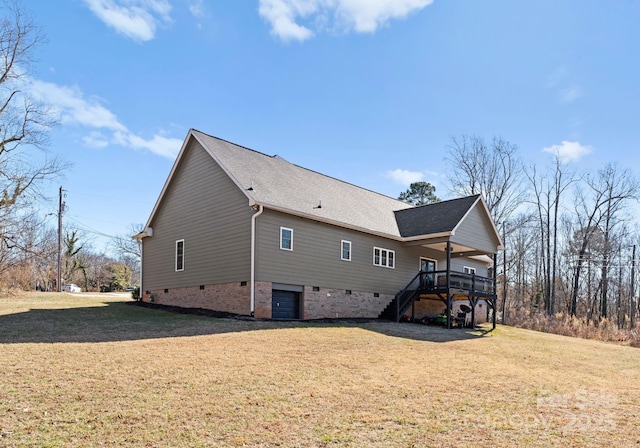 view of home's exterior with a yard and a deck