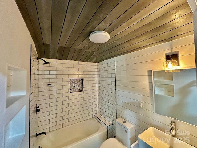 bathroom with wooden ceiling, toilet, wood walls, and shower / tub combination