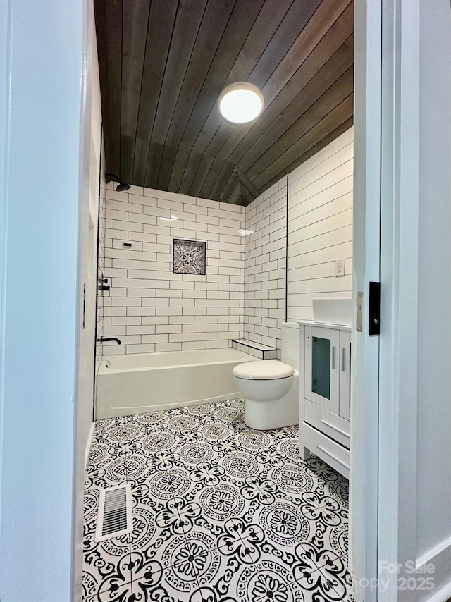 full bathroom with toilet, wood ceiling, shower / tub combination, and tile patterned floors