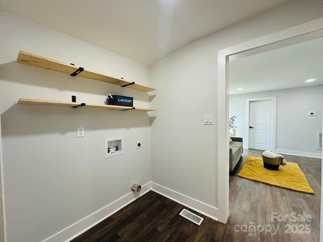 laundry room with laundry area, visible vents, dark wood-type flooring, hookup for an electric dryer, and washer hookup