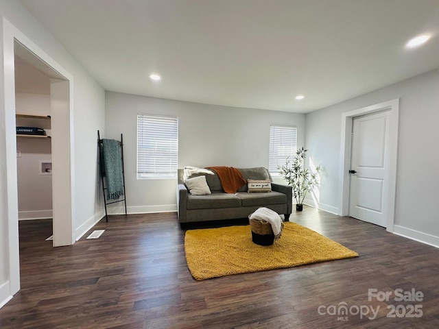 living room with baseboards, dark wood-style flooring, and recessed lighting