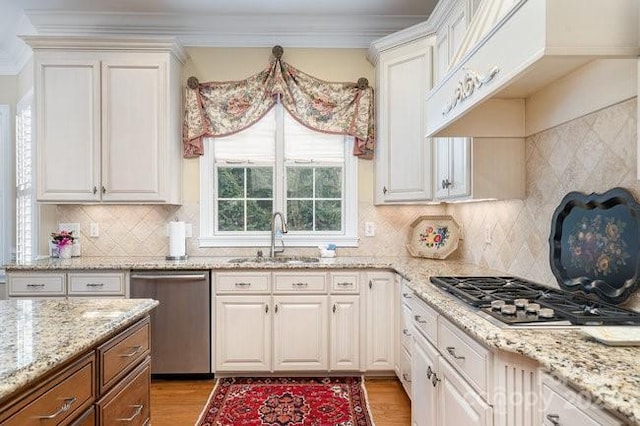 kitchen featuring white cabinetry, appliances with stainless steel finishes, and sink