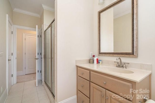 bathroom featuring walk in shower, tile patterned floors, vanity, and crown molding