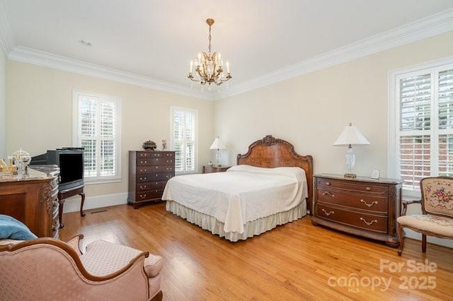 bedroom featuring wood-type flooring, ornamental molding, and a chandelier