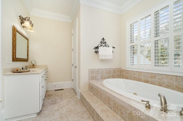 bathroom with crown molding, plenty of natural light, and vanity