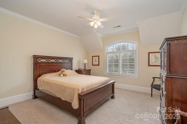 carpeted bedroom with ornamental molding and ceiling fan