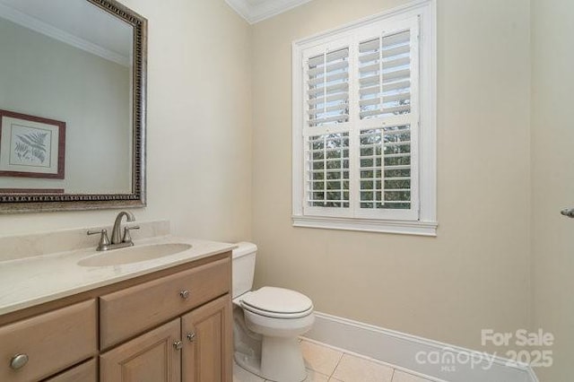 bathroom with ornamental molding, tile patterned floors, toilet, and vanity