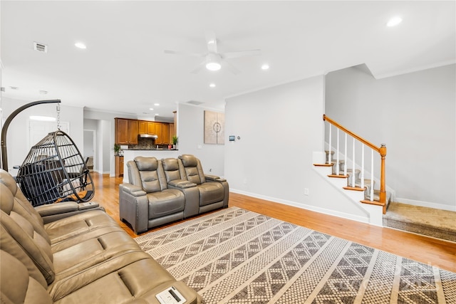 living room featuring ceiling fan and light wood-type flooring