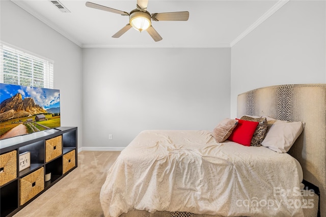 bedroom featuring ornamental molding, light colored carpet, and ceiling fan