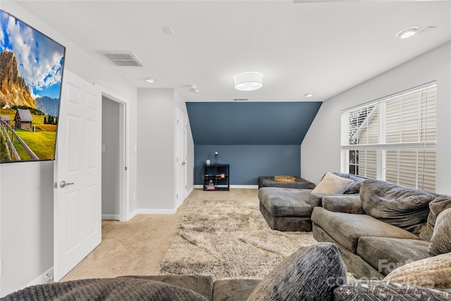 living room featuring vaulted ceiling and light carpet