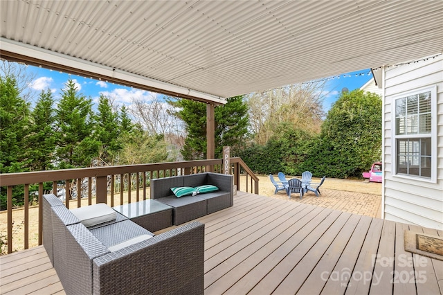 wooden terrace with outdoor lounge area