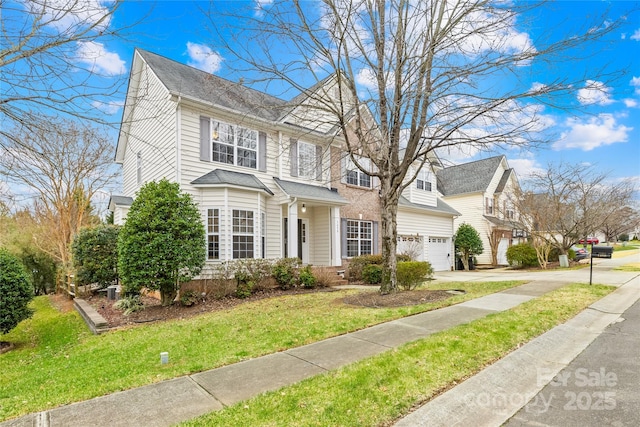 view of front of house featuring a garage and a front yard