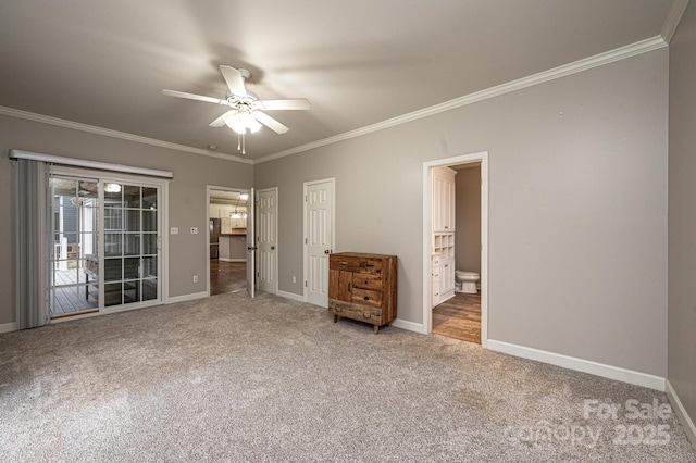 unfurnished bedroom with carpet floors, ornamental molding, access to exterior, ceiling fan, and ensuite bath