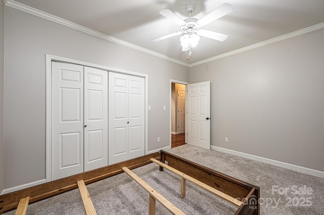 bedroom with crown molding, wood-type flooring, ceiling fan, and a closet