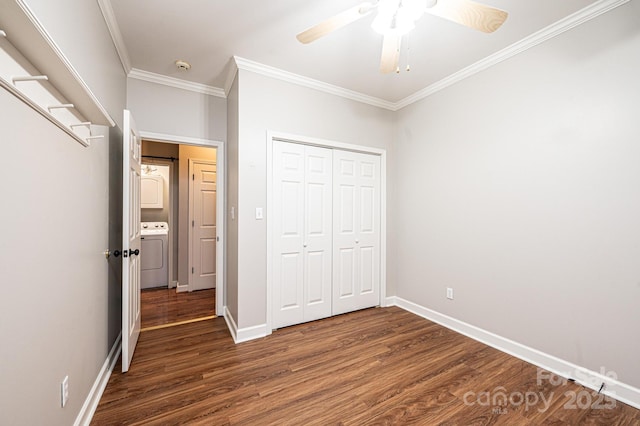 unfurnished bedroom featuring crown molding, dark hardwood / wood-style flooring, a closet, ceiling fan, and washer / clothes dryer