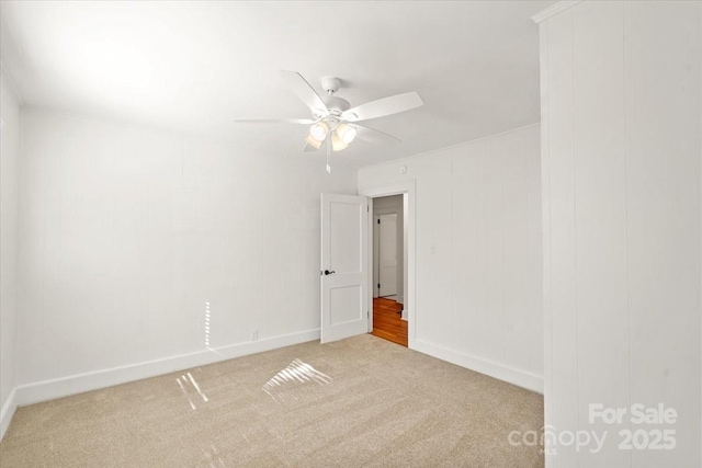 unfurnished room with light carpet and ceiling fan