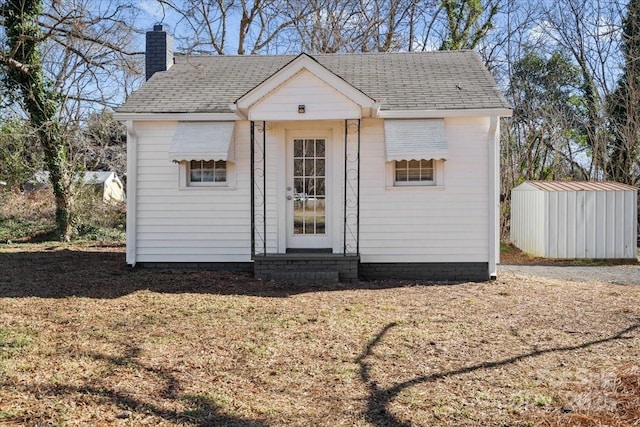 view of outbuilding with a yard