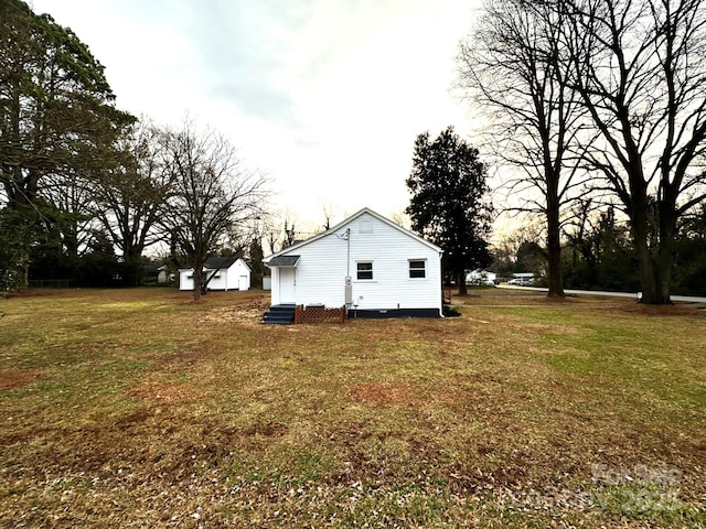 view of home's exterior featuring a lawn