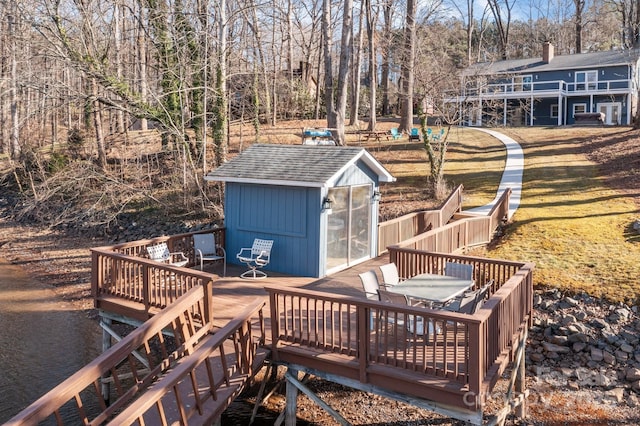 deck featuring an outdoor structure