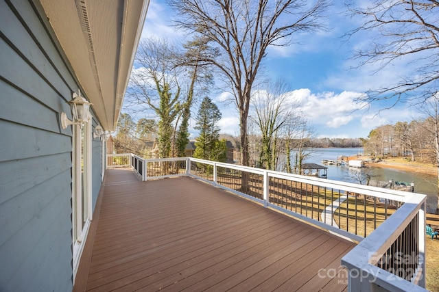 wooden terrace featuring a water view