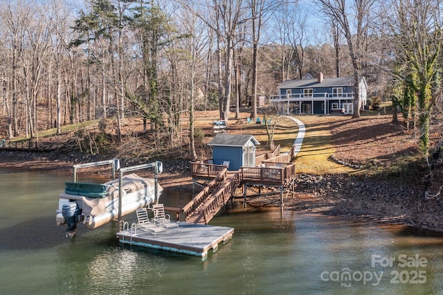 dock area featuring a deck with water view