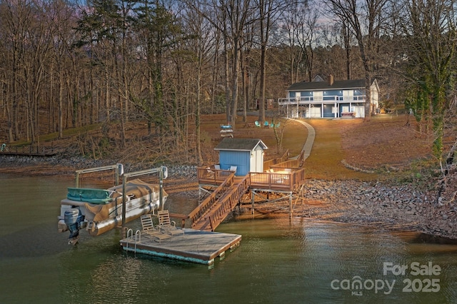 dock area with a deck with water view