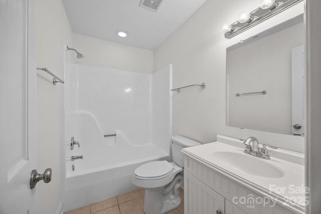 full bathroom featuring tile patterned flooring, vanity, toilet, and washtub / shower combination