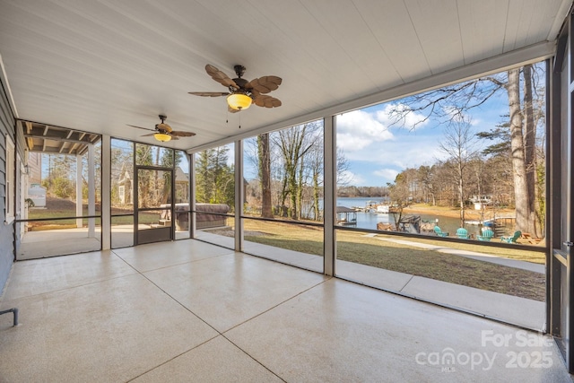 unfurnished sunroom with a water view