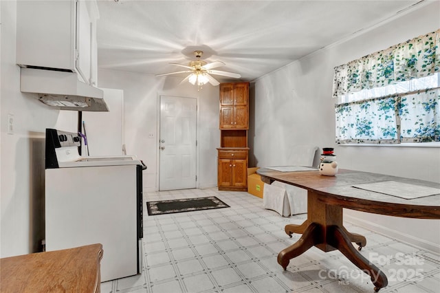 kitchen featuring ceiling fan and washer / clothes dryer