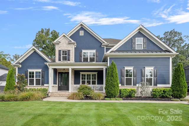 craftsman-style home with a porch and a front yard