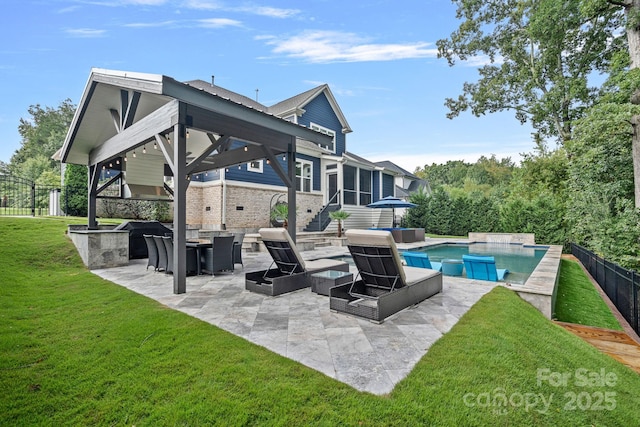 view of pool featuring a gazebo, a yard, a sunroom, and a patio area