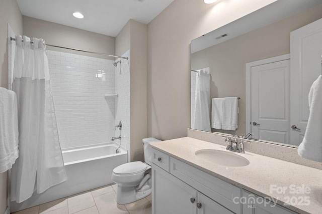 full bathroom featuring vanity, shower / tub combo with curtain, tile patterned floors, and toilet