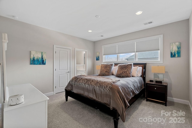 carpeted bedroom with connected bathroom