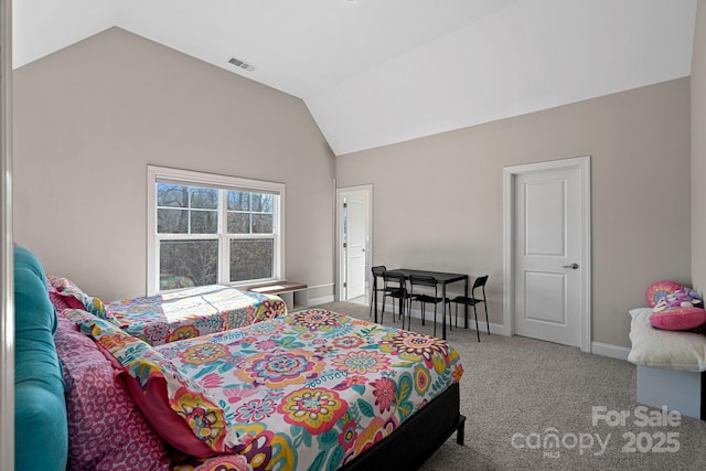 bedroom featuring lofted ceiling and carpet floors