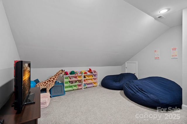 playroom with carpet floors and vaulted ceiling