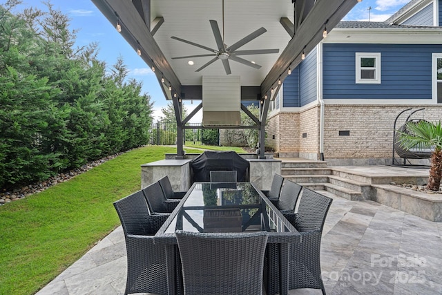 view of patio with ceiling fan