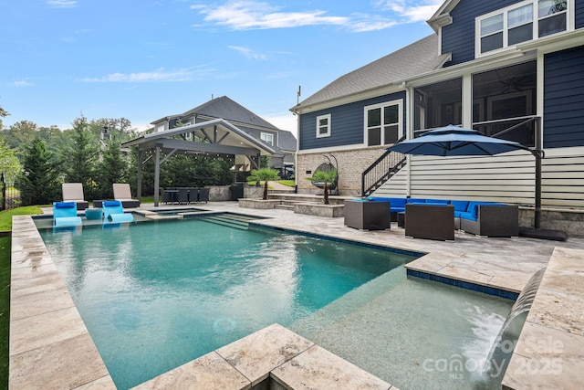 view of pool featuring a gazebo, an outdoor hangout area, ceiling fan, and a patio area