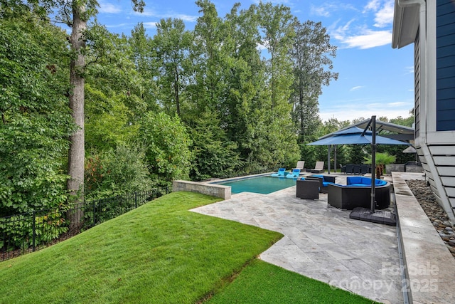 view of swimming pool featuring a yard, a patio area, and outdoor lounge area