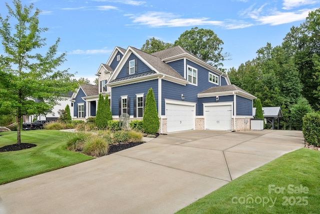 view of front facade with a garage and a front lawn