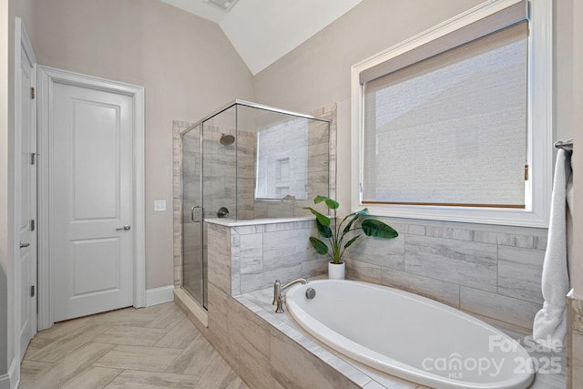 bathroom with vaulted ceiling and separate shower and tub