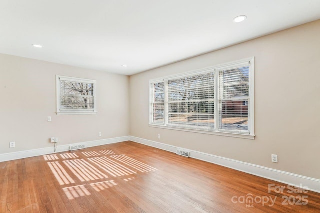 empty room featuring wood-type flooring